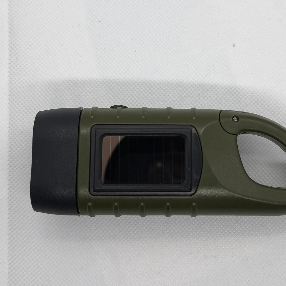 Hand Crank Flashlight top view with the solar panel, LED head and carabiner