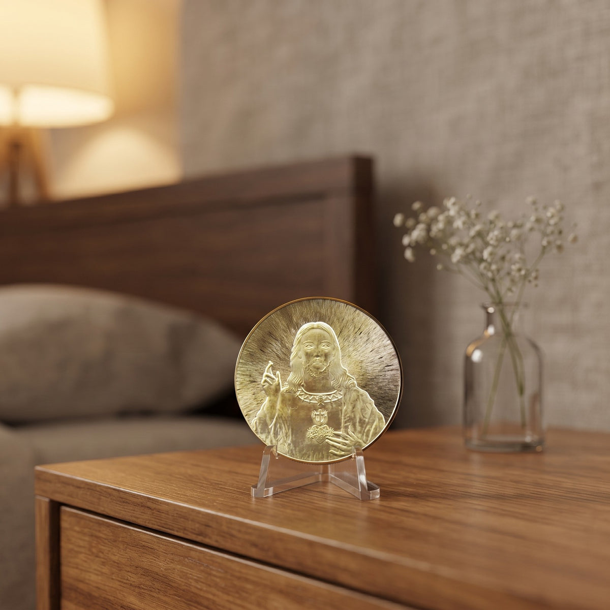 Jesus Commemorative Coin on a small clear stand on a bedroom nightstand