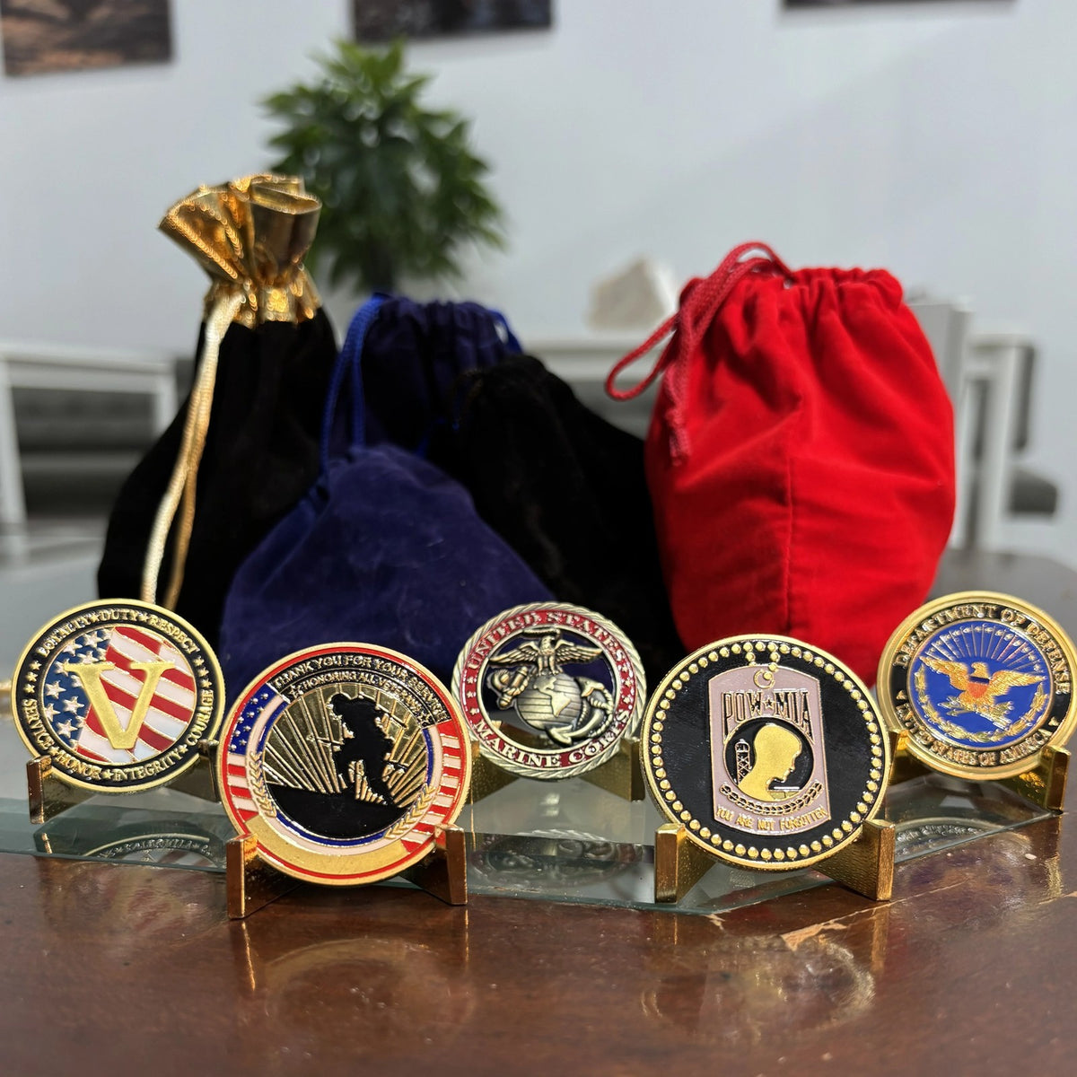 Marine Tribute Coin with other tribute coins from our line and velvet pouches (sold separately)