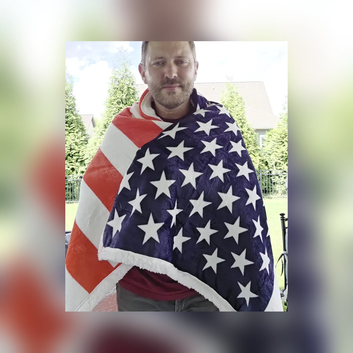 Man wrapped in the USA Flag Throw Blanket in a backyard