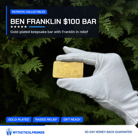 Ben Franklin $100 gold-plated bar held in a white-gloved hand