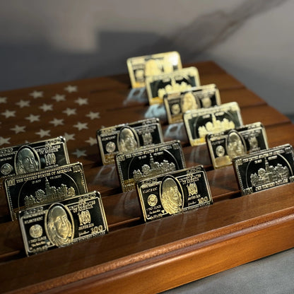 Rows of Ben Franklin $100 gold-plated bars on a wooden star display tray