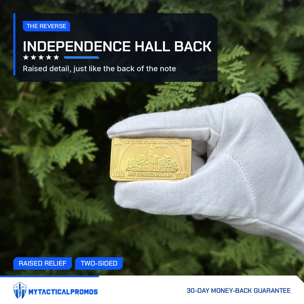 Back of the Ben Franklin $100 gold-plated bar showing Independence Hall, held in a white glove