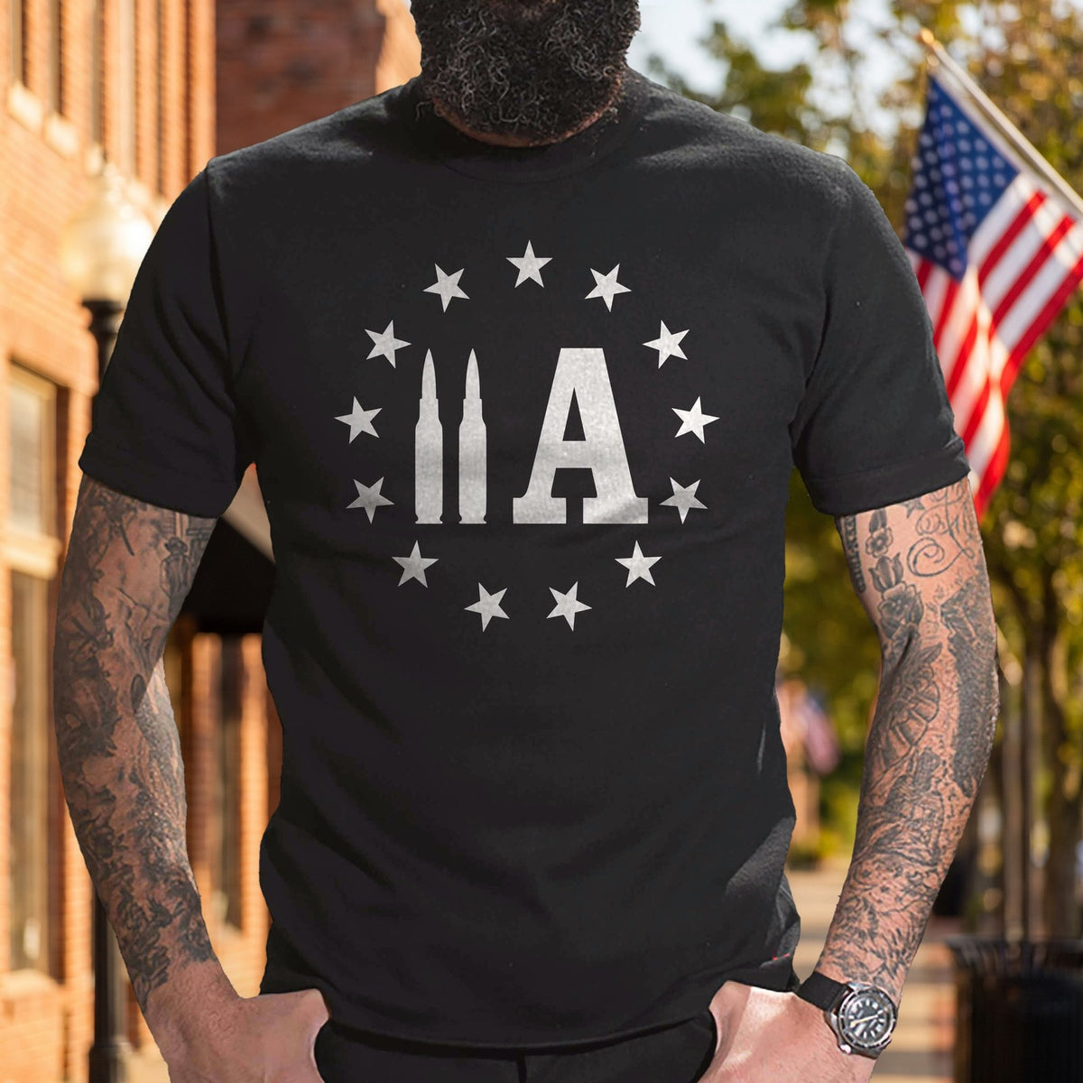 2A Bullet T-Shirt worn on a flag-lined main street
