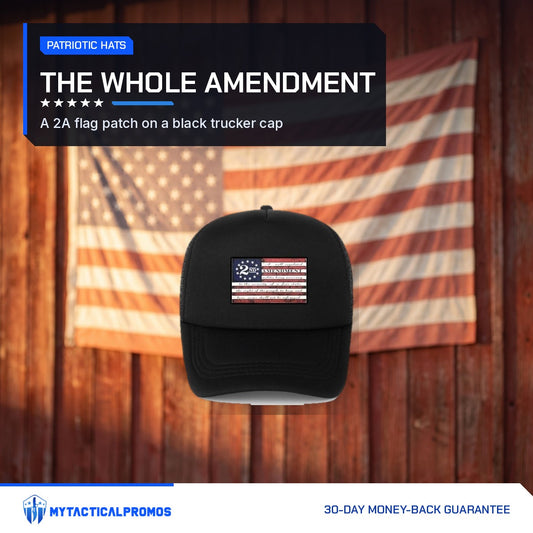 2nd Amendment Hat black trucker cap in front of an American flag on a barn wall
