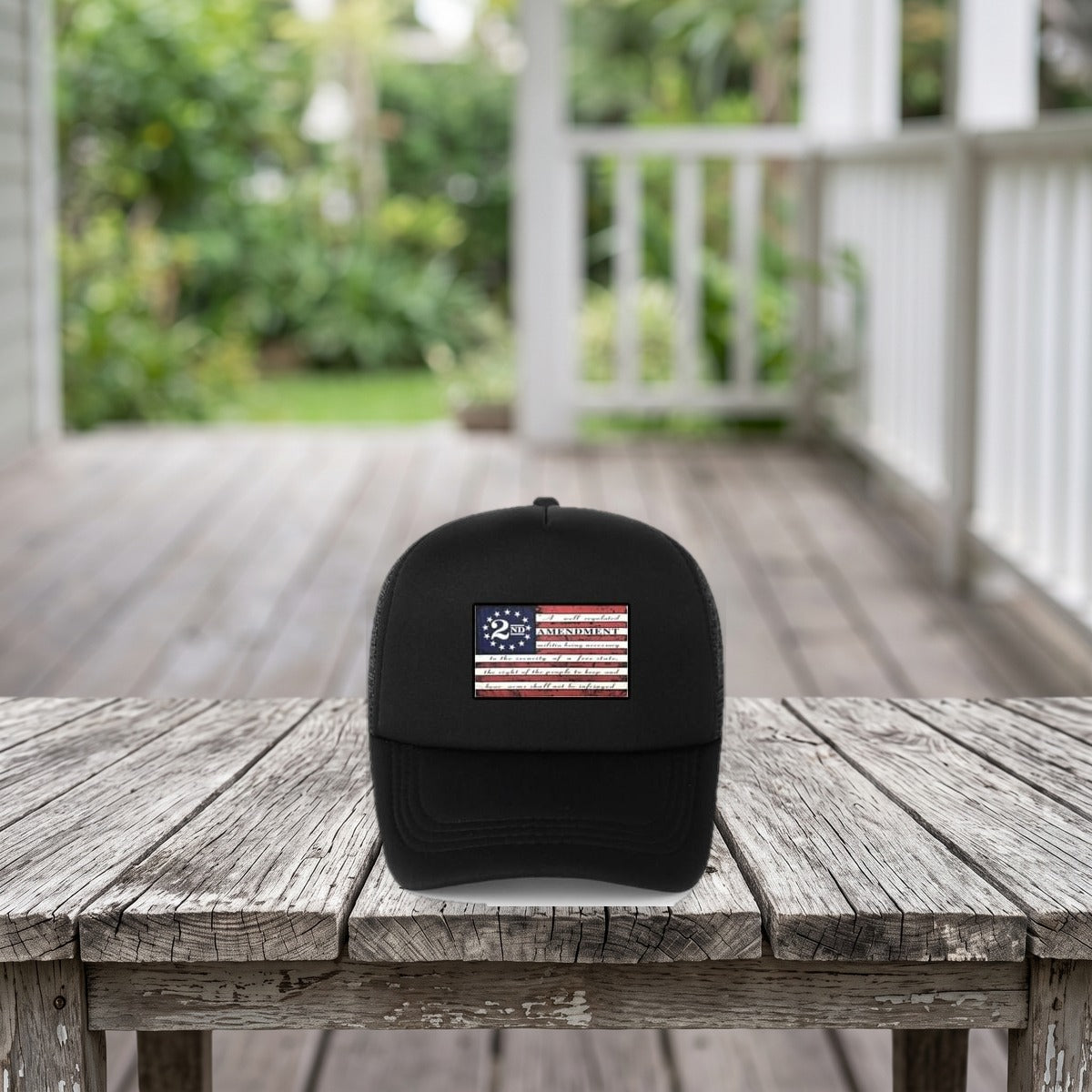 2nd Amendment Hat on a weathered porch table