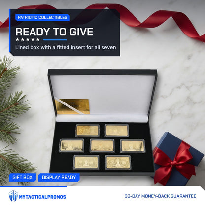7-piece gold-plated currency bar set on marble with a gift box and ribbon