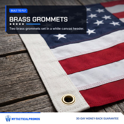 American Flag canvas header with a brass grommet and embroidered stars on a wooden deck