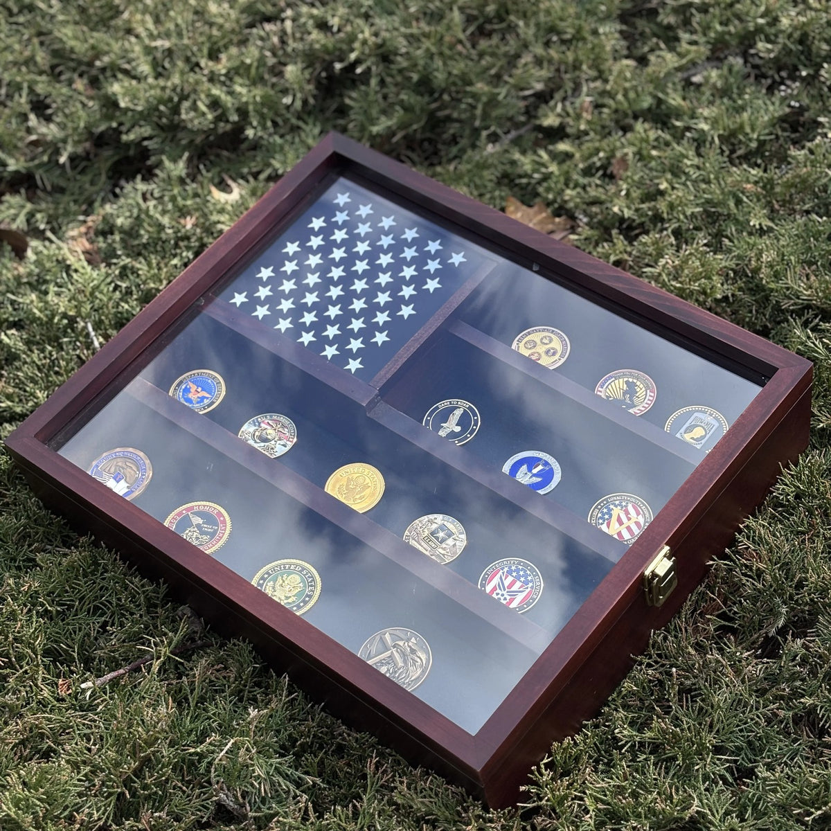 American Flag Challenge Coin Display Case lying flat, showing the star panel and coins behind the door