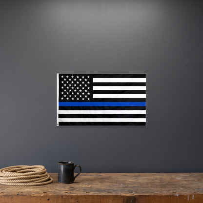 Thin Blue Line Flag on a dark gray garage wall above a workbench