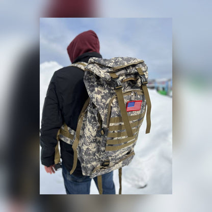 Man wearing the Bugout Backpack in the snow
