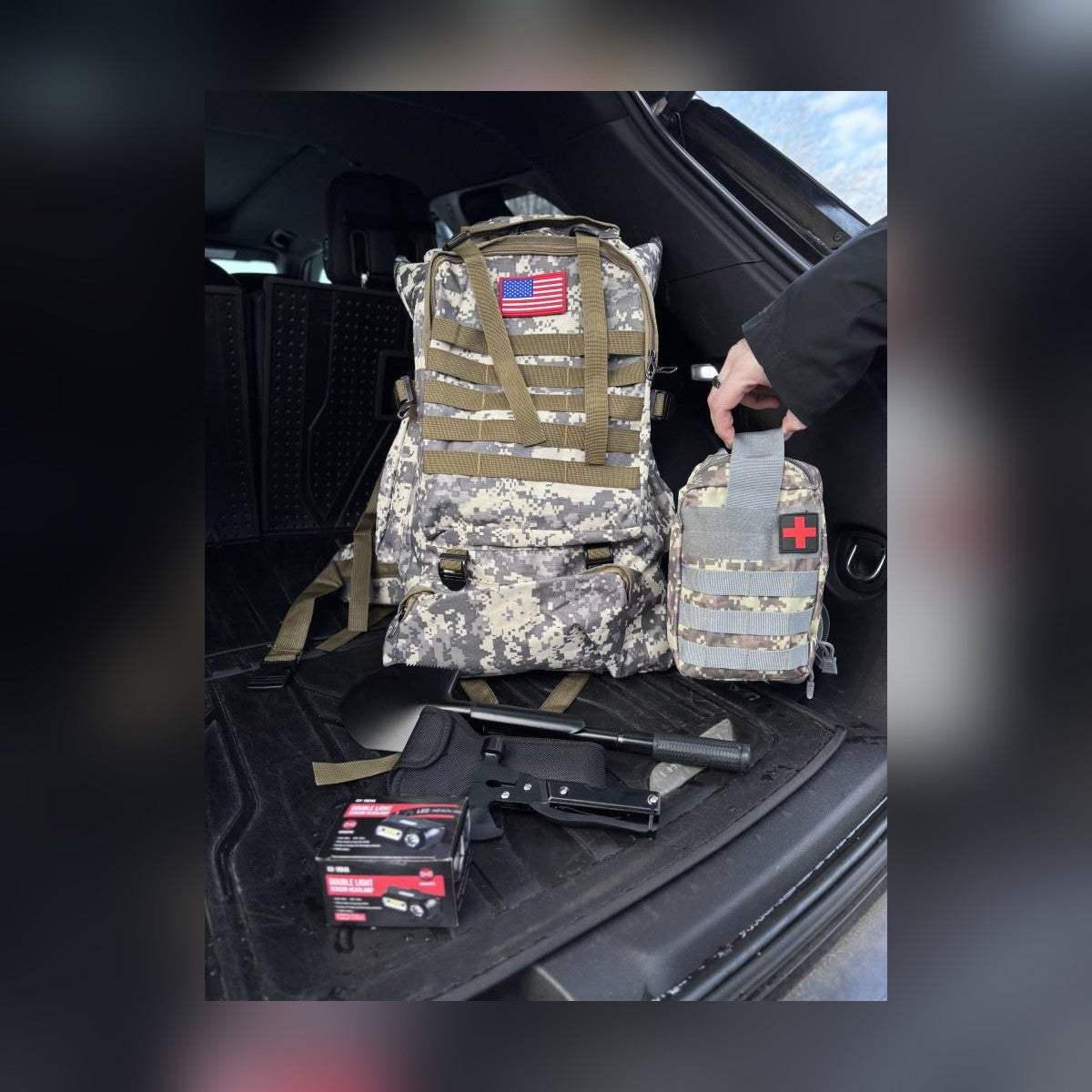 Bugout Backpack and medical pouch loaded into a vehicle trunk