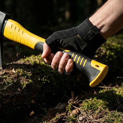 Gloved hand gripping the Camping Hatchet handle on a mossy log