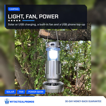 Solar Camping Lantern lit and hanging from a tree branch by its steel handles