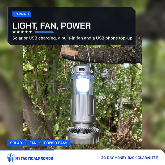 Solar Camping Lantern lit and hanging from a tree branch by its steel handles