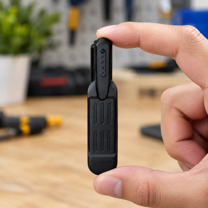 Clip-On Mini Spy Camera held between two fingers to show its size