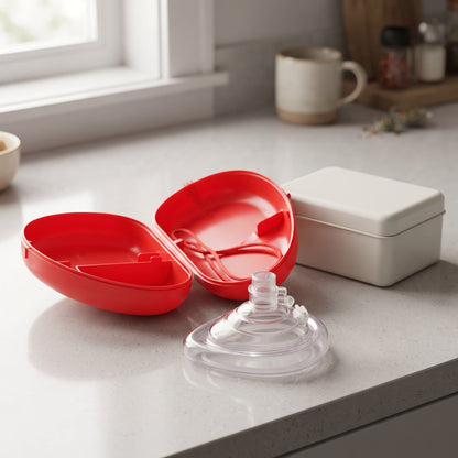 CPR Car Kit open red case and mask on a kitchen counter at home