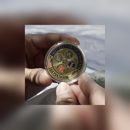 Defense Tribute Coin Pentagon side in its clear capsule, held in hand