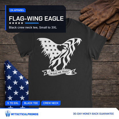 Eagle In God We Trust T-Shirt laid flat on a dark wood table with a folded flag