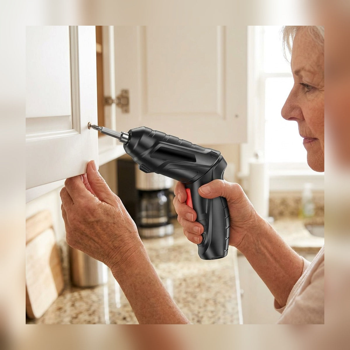 Woman tightening a kitchen cabinet hinge with the Cordless Electric Screwdriver