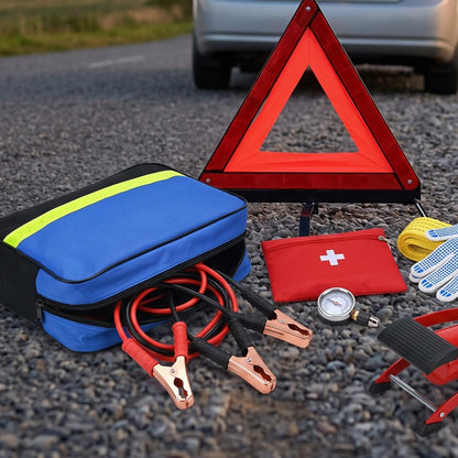 Emergency Car Kit warning triangle set up on a road shoulder with the bag, cables and foot pump