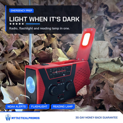 Emergency Radio with flip-up lamp lit, sitting in fall leaves