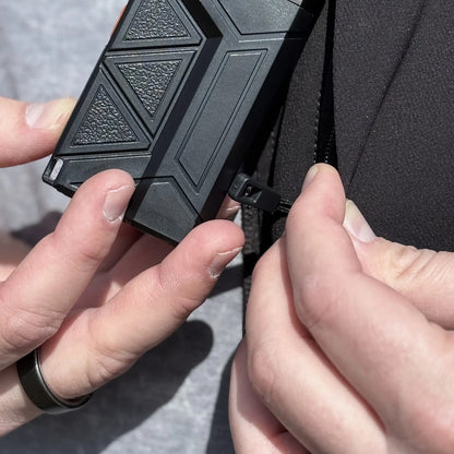 Flat Flashlight being slipped into a jacket pocket