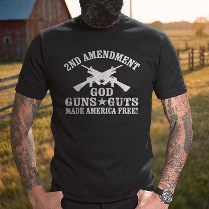 God, Guns and Guts T-Shirt worn by a ranch fence at golden hour