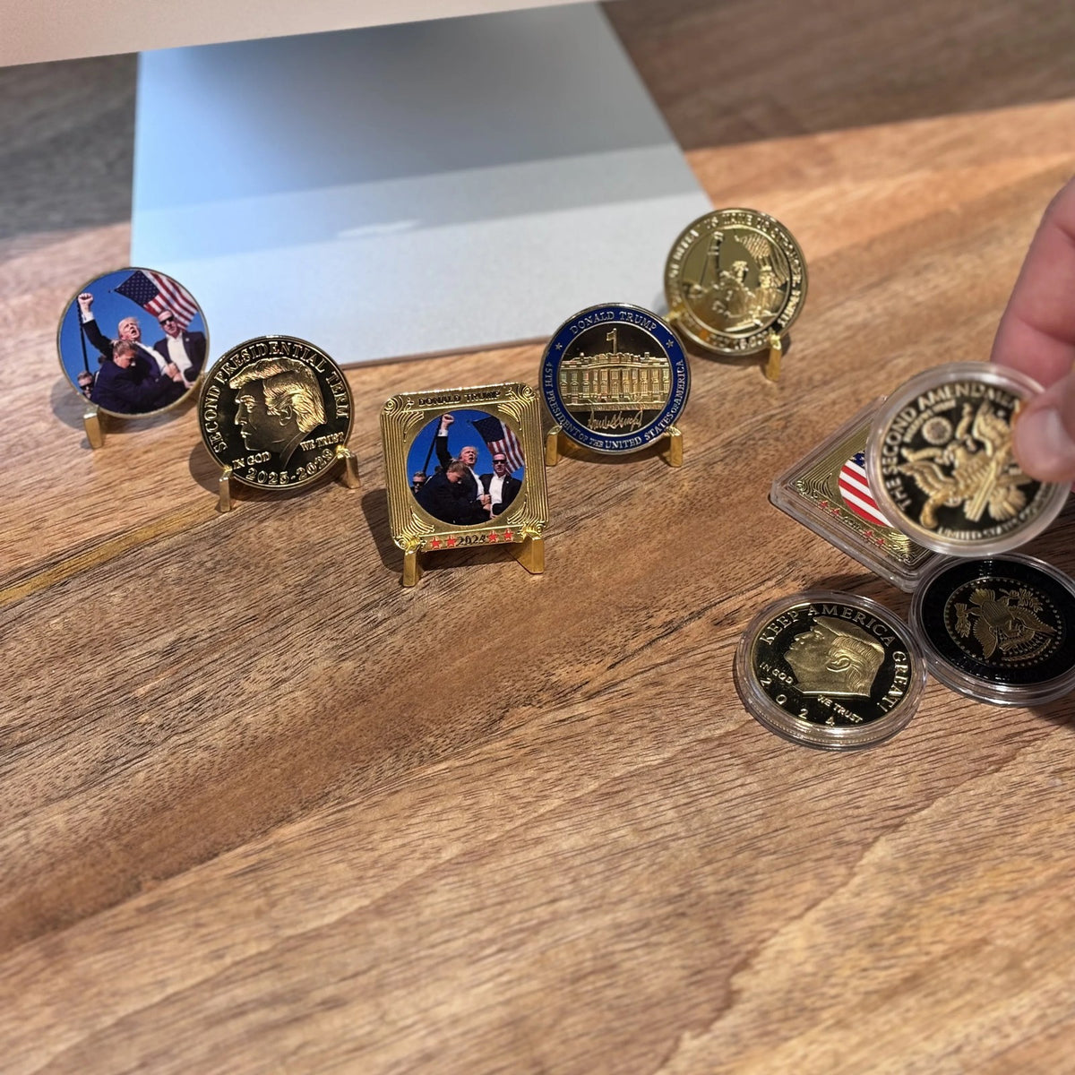 Second Amendment Coin in hand beside other coins from our patriotic line on small stands (sold separately)
