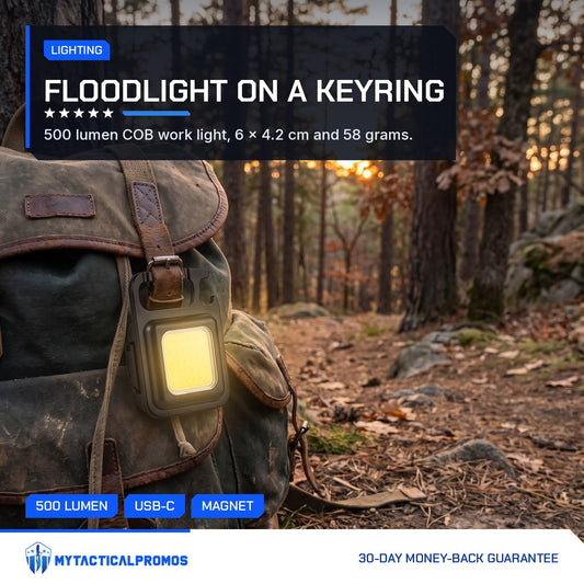 Keychain Light clipped to a backpack on a forest trail