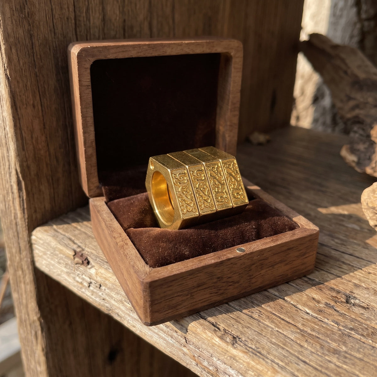Knuckle Ring in a wooden gift box on a rustic shelf