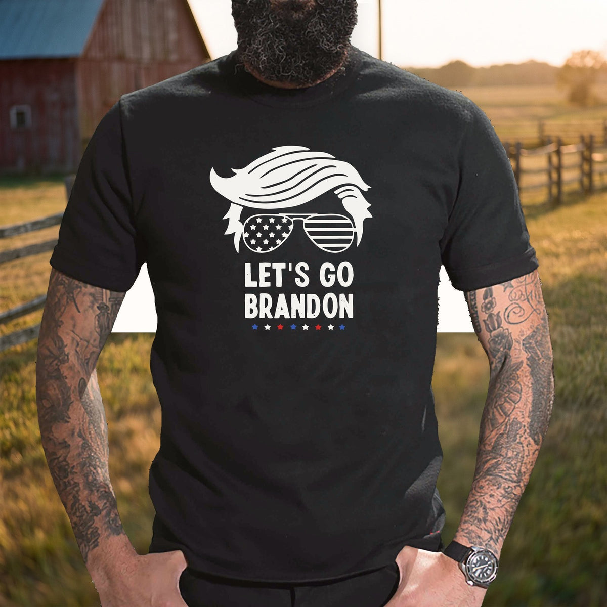 Let's Go Brandon T-Shirt worn by a ranch fence at golden hour