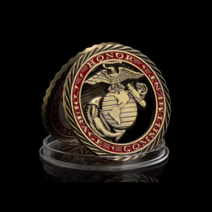Marine Tribute Coin Honor, Courage, Commitment side in its clear capsule