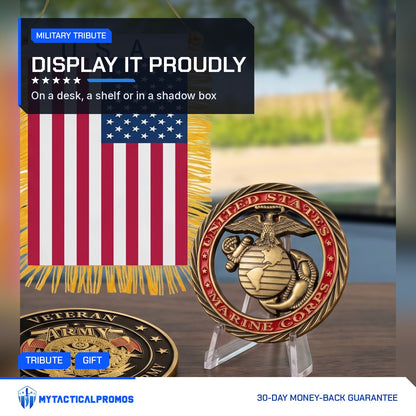 Marine Tribute Coin on a small clear stand beside a folded flag