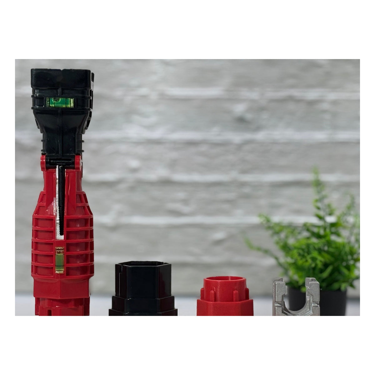 Masterfit 22-in-1 Wrench with its black socket adapter, red socket adapter and metal clip