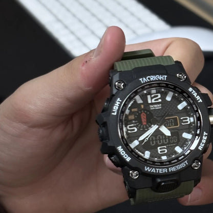 Military Watch held in hand at a desk