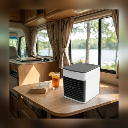 Mini Air Cooler on the dinette table inside a camper van