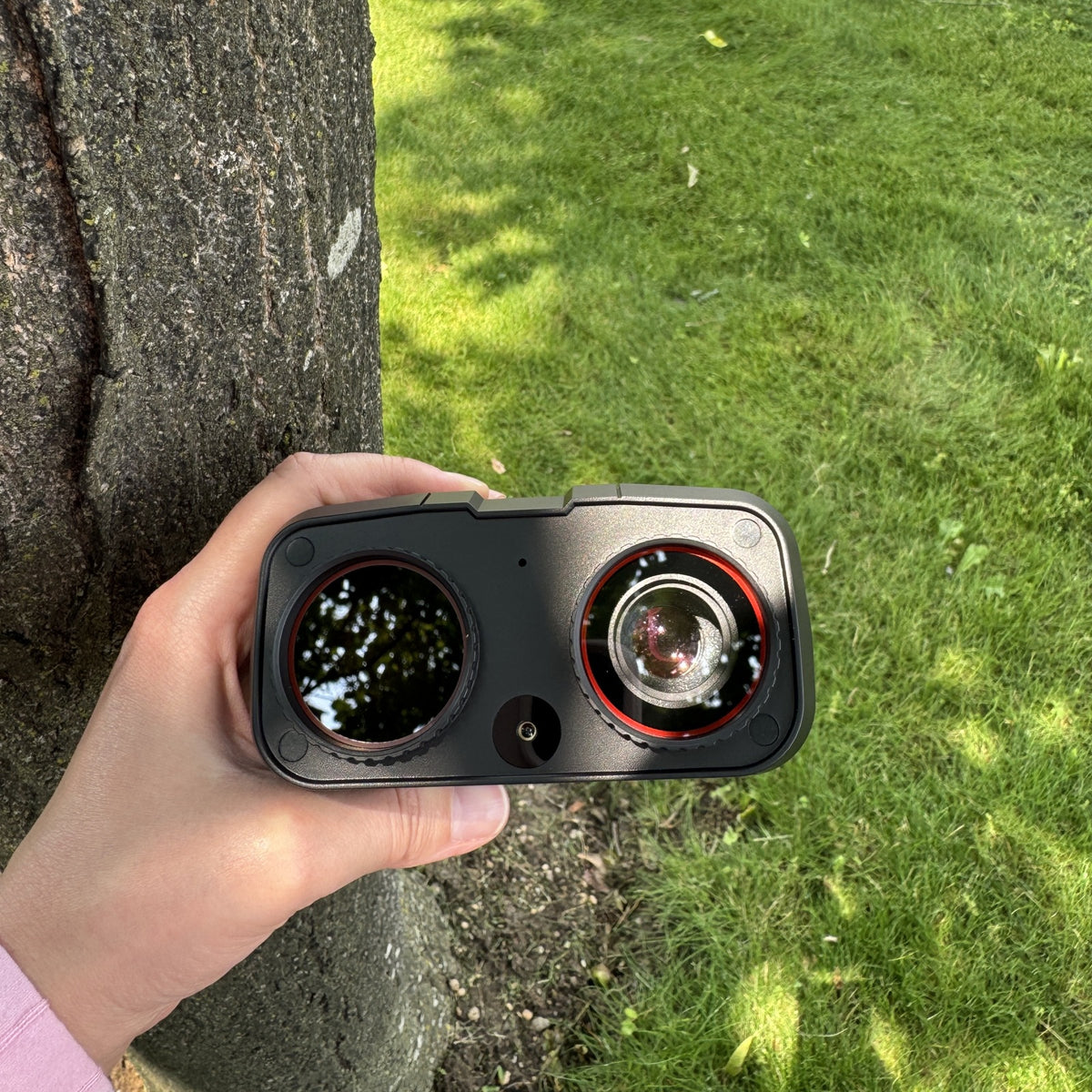 Night Vision Binoculars twin lenses held up close outdoors