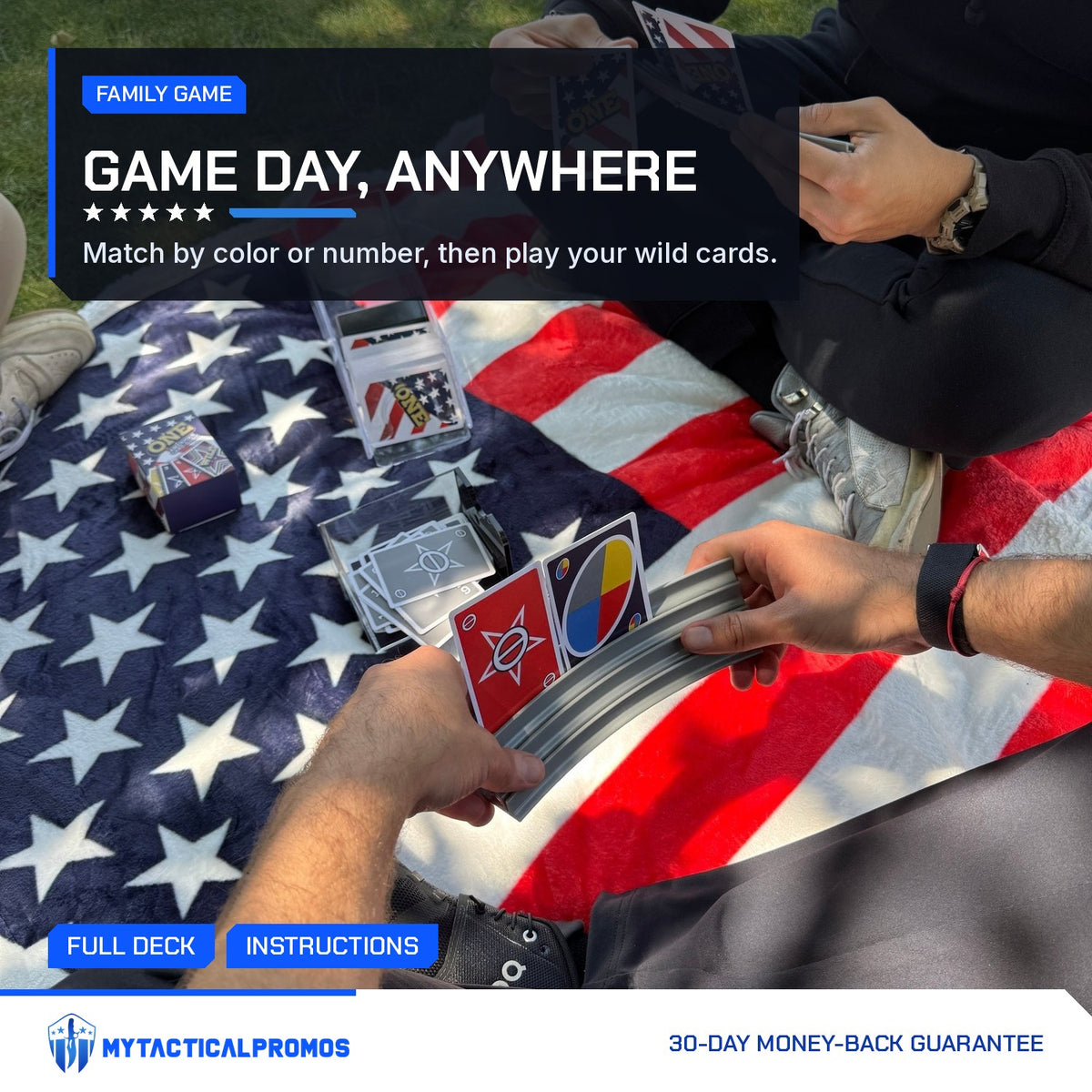 Friends playing the ONE American Card Game on a flag blanket in the park