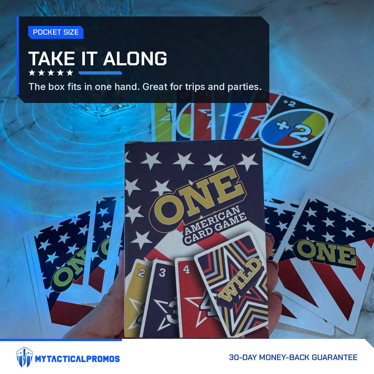 ONE American Card Game box held in one hand over a spread of cards