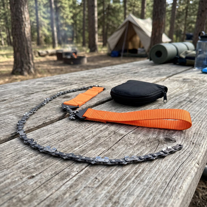Pocket Chain Saw coiled on a picnic table next to its pouch