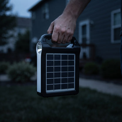 Portable Power Station carried by its handle at dusk