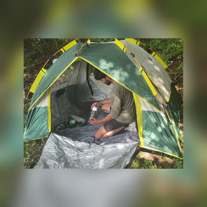 Man sitting inside the Quick Popup Tent with the door open