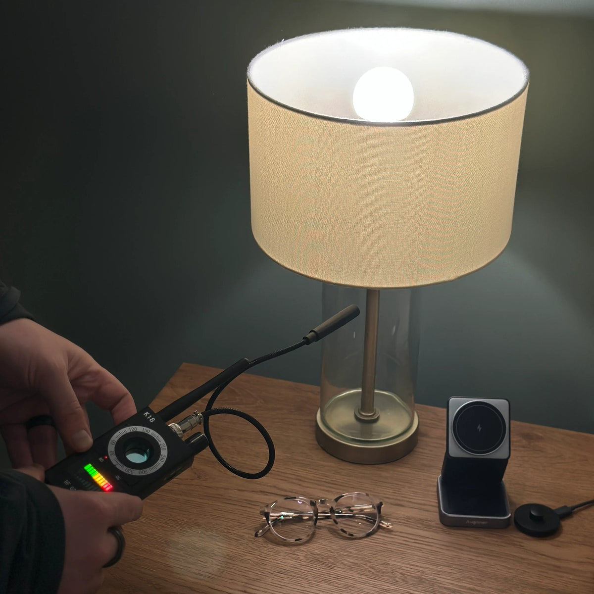Spy Bug Detector scanning a bedside table and lamp