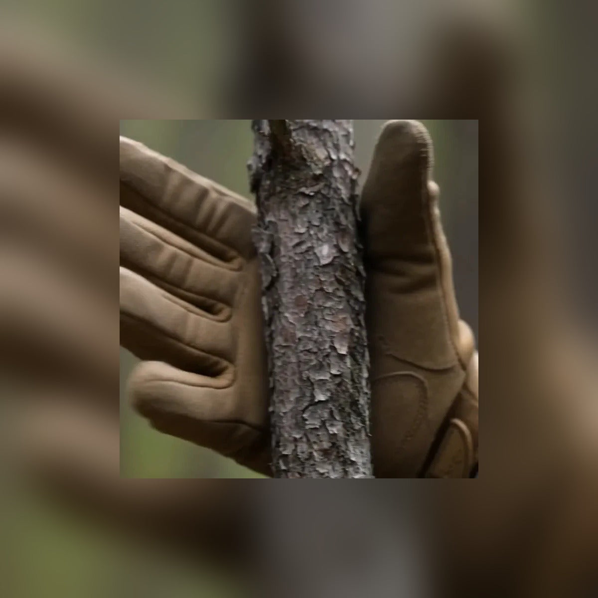 Gloved hand gripping a tree trunk in the Tactical Gloves