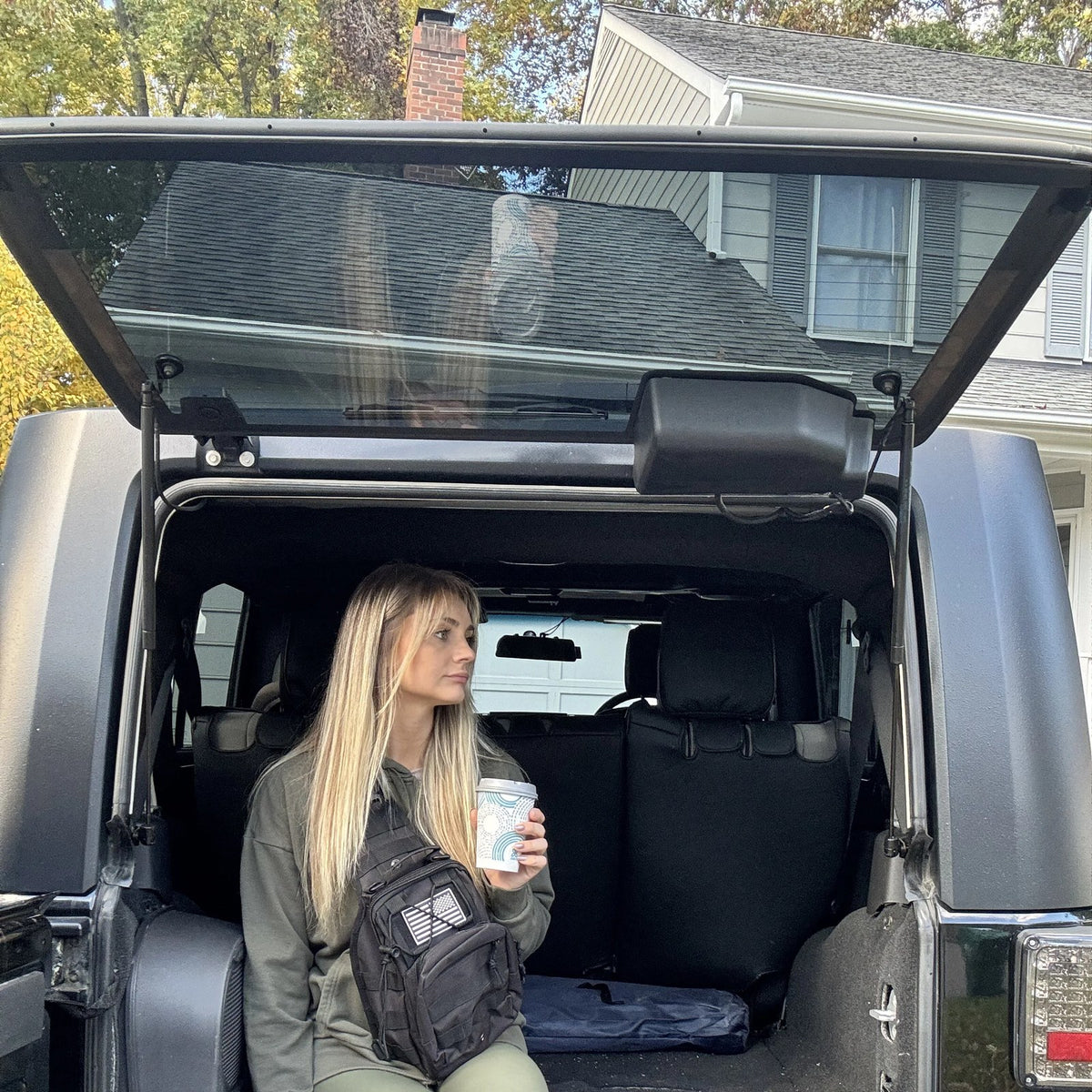 Woman wearing the Tactical Shoulder Bag at a Jeep tailgate