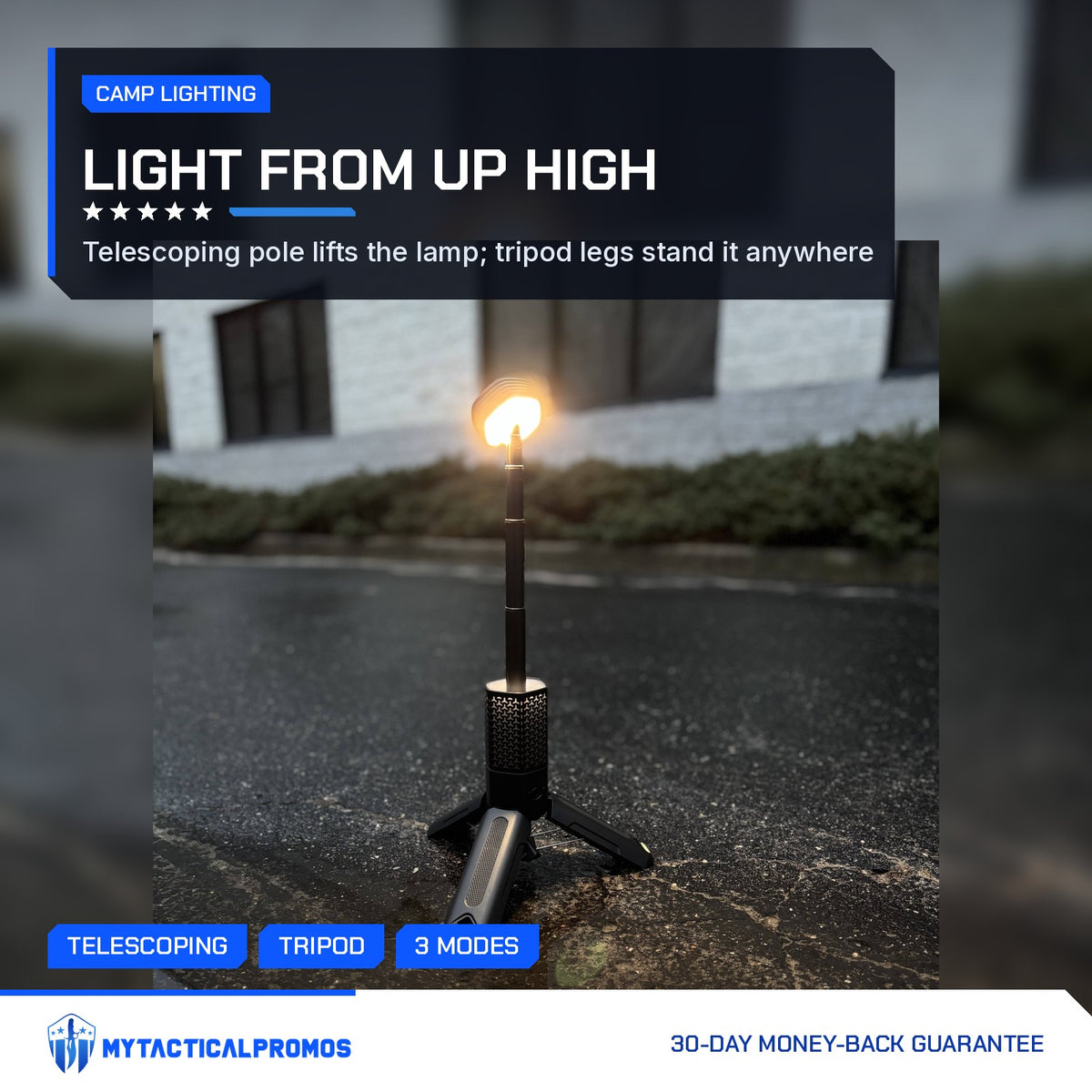 Telescoping Camping Lantern extended and lit on its tripod on wet pavement at dusk