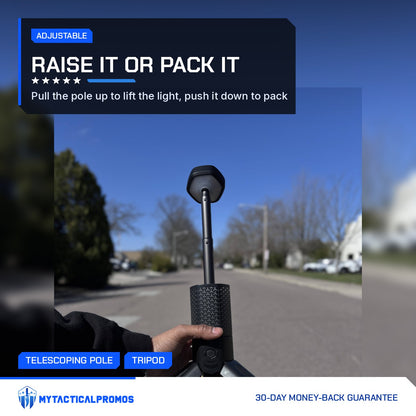 Hand holding the Telescoping Camping Lantern with the pole extended and legs open