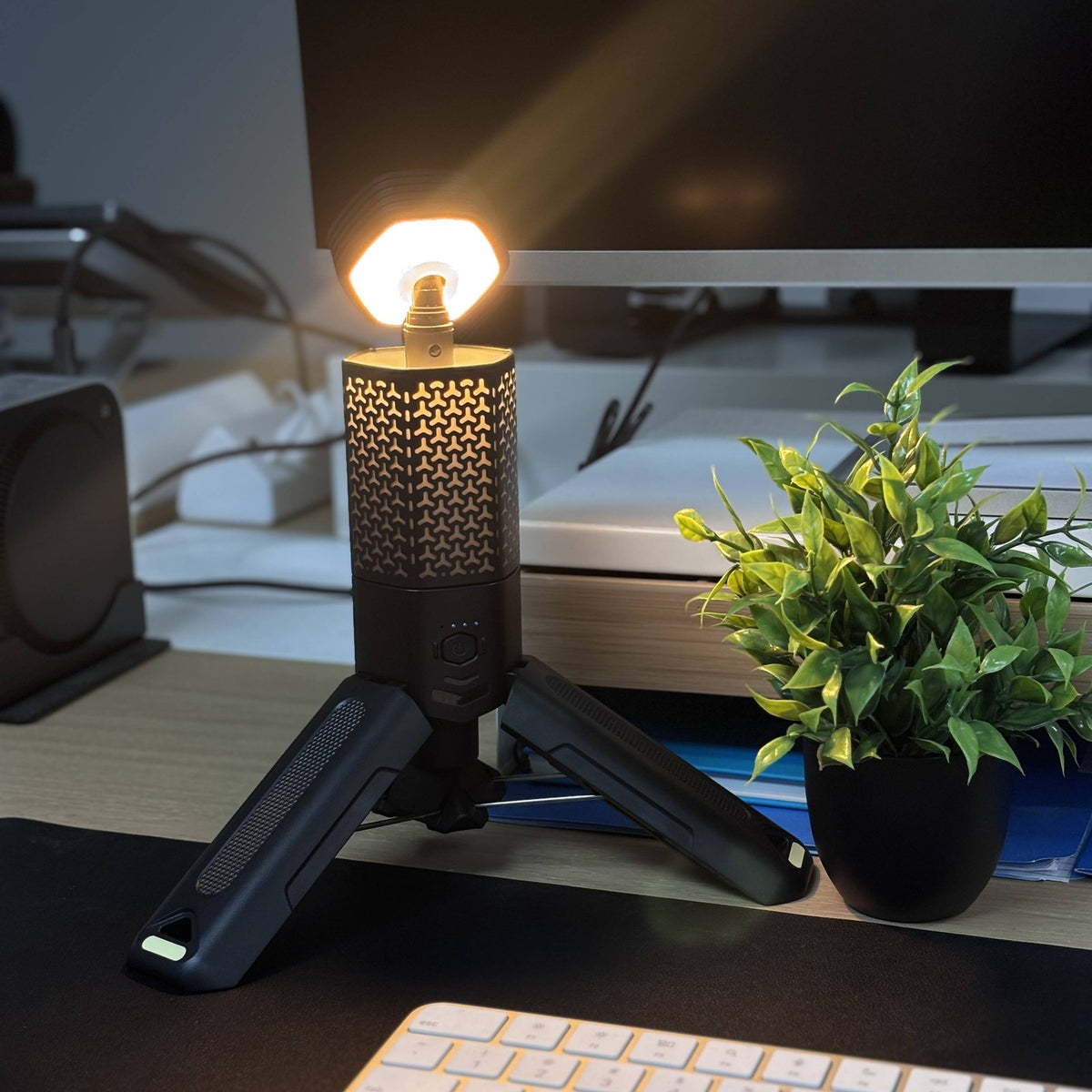 Telescoping Camping Lantern lit warm on a home desk
