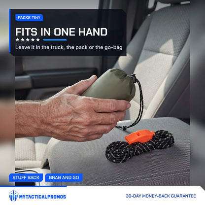 Hand holding the small stuff sack of the Emergency Tube Tent kit in a truck cab